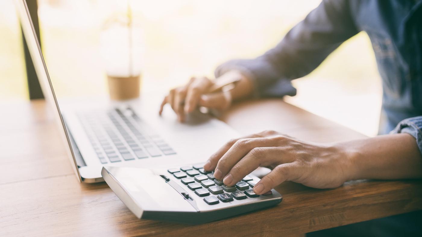 Man using calculator