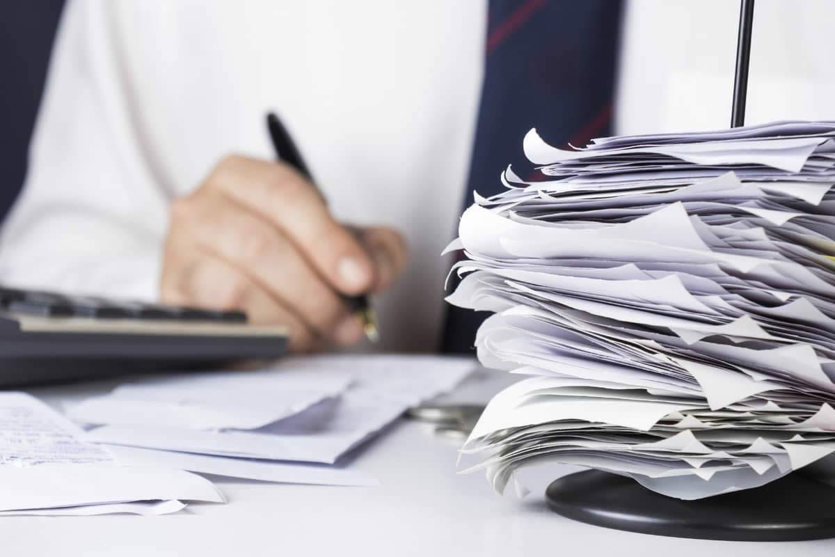 Working through mounds of paperwork