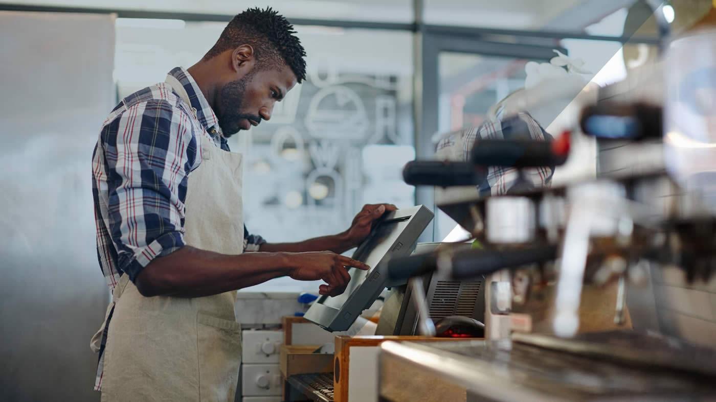 Cafe worker using POS