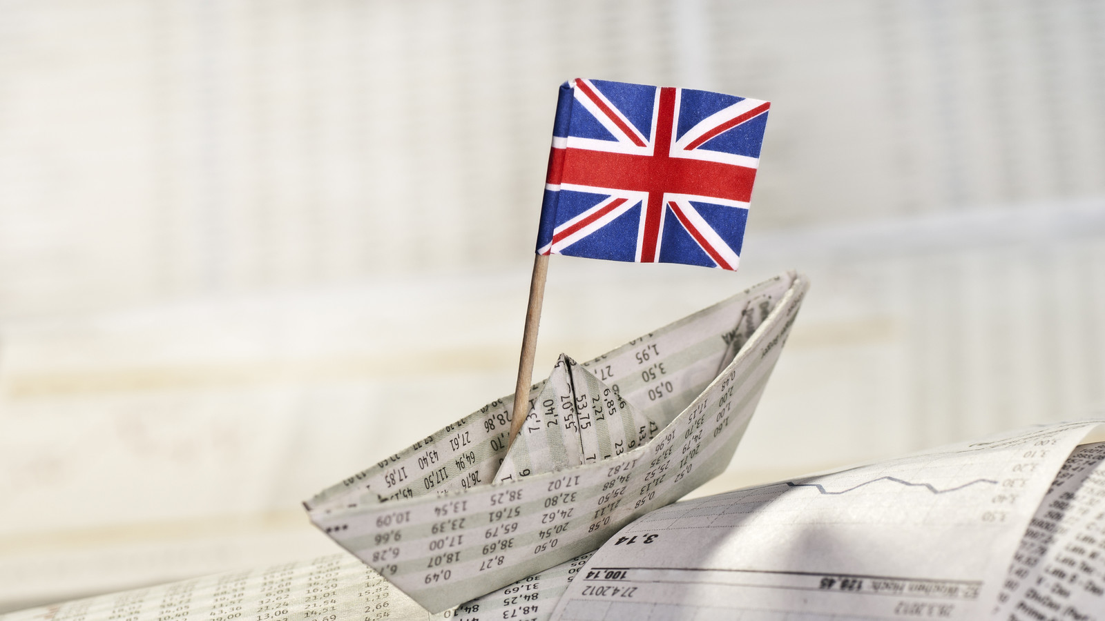British flag on paper ship