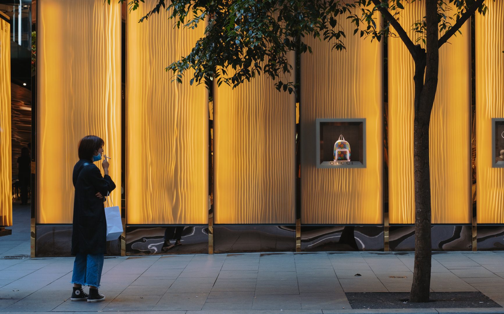 Women smoking looking at a handbag