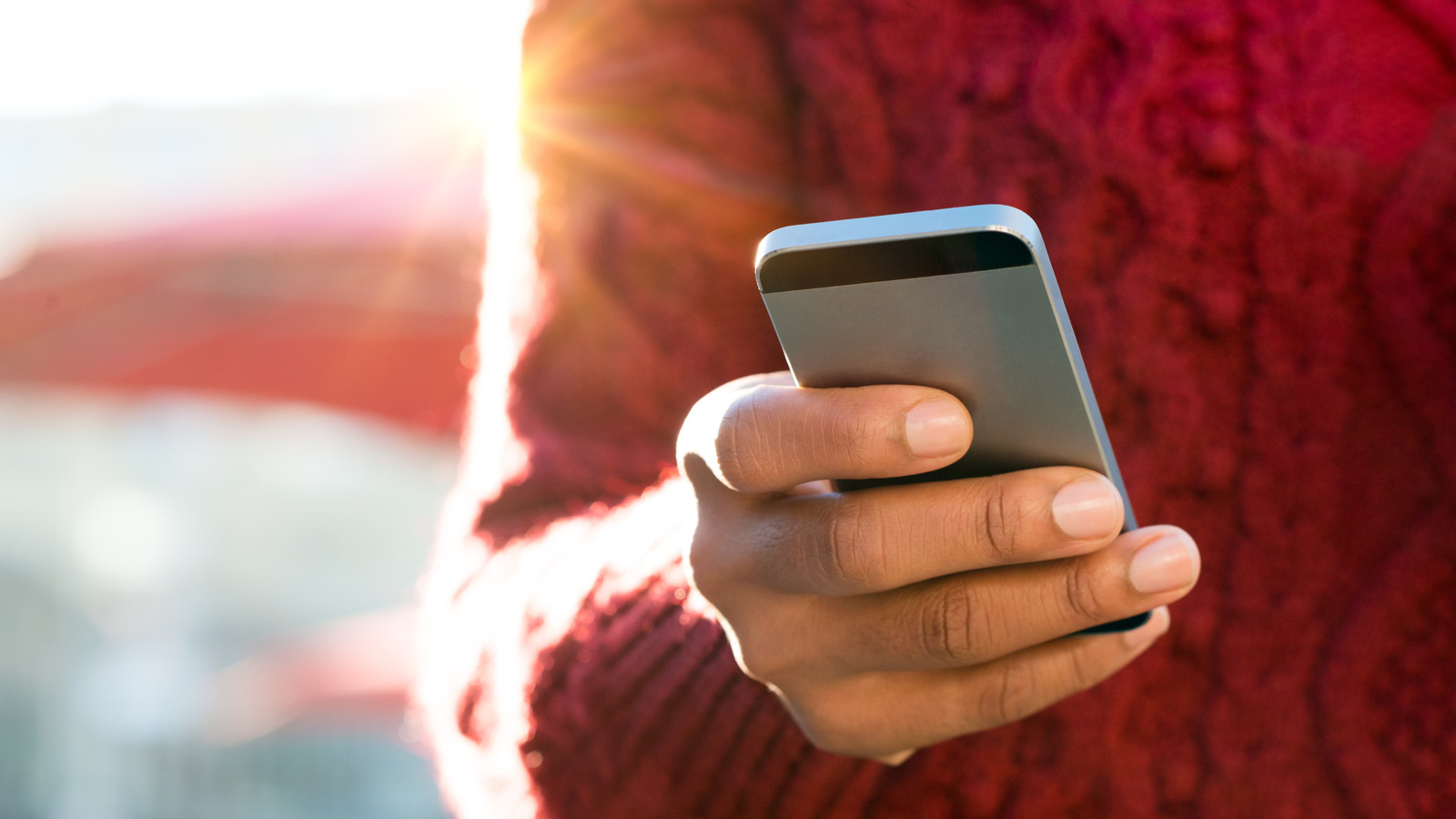 Hand typing on phone